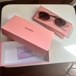 Miu Miu Oval Sunglasses